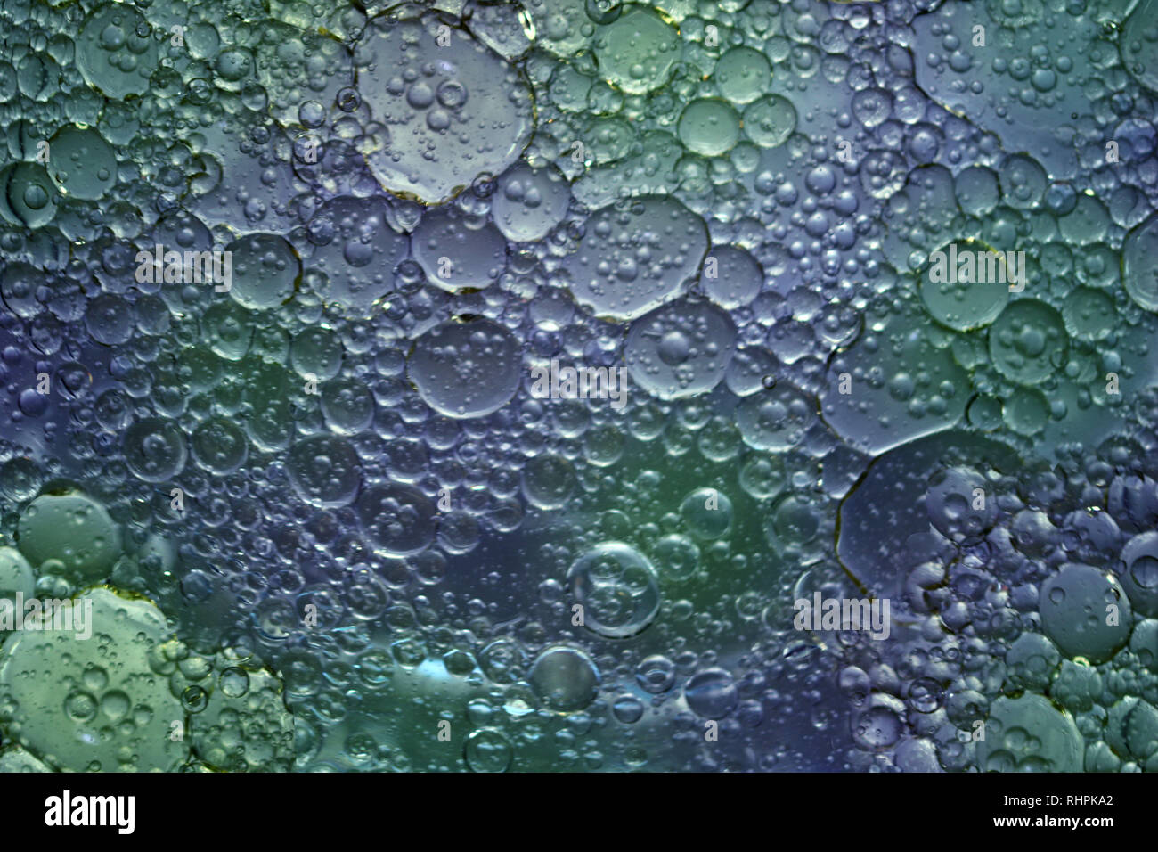 Divertiti con la fotografia macro di olio e acqua Foto Stock