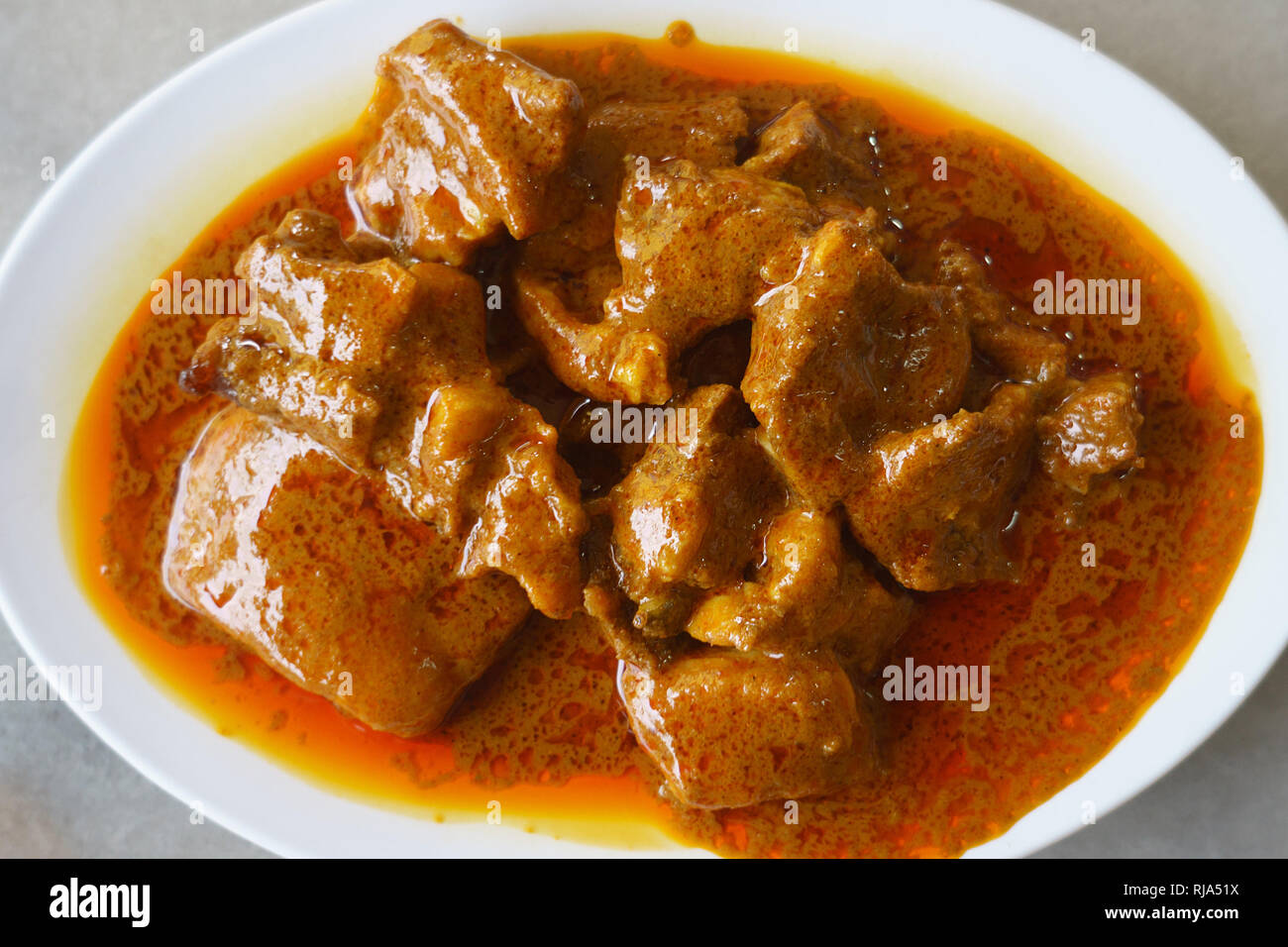 Malaysian street food una deliziosa indiano curry di montone sul tavolo setup. Foto Stock