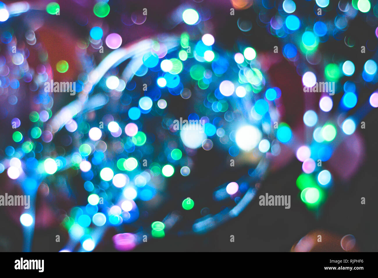 Sfocata bolle di superficie. Natale sfondo bokeh di fondo. Colore luci unfocussed. circolare bokeh sparkle glitter sfondo delle luci. Felice Anno Nuovo concetto Foto Stock
