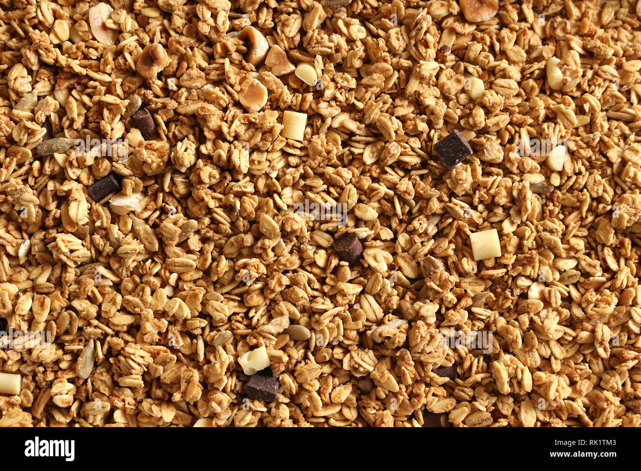 Muesli con scaglie di cioccolato e sana prima colazione sullo sfondo di cereali Foto Stock