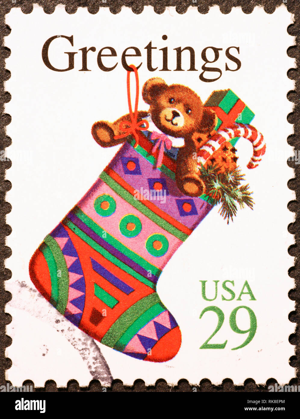 Calza di Natale pieno di presente su american francobollo Foto Stock
