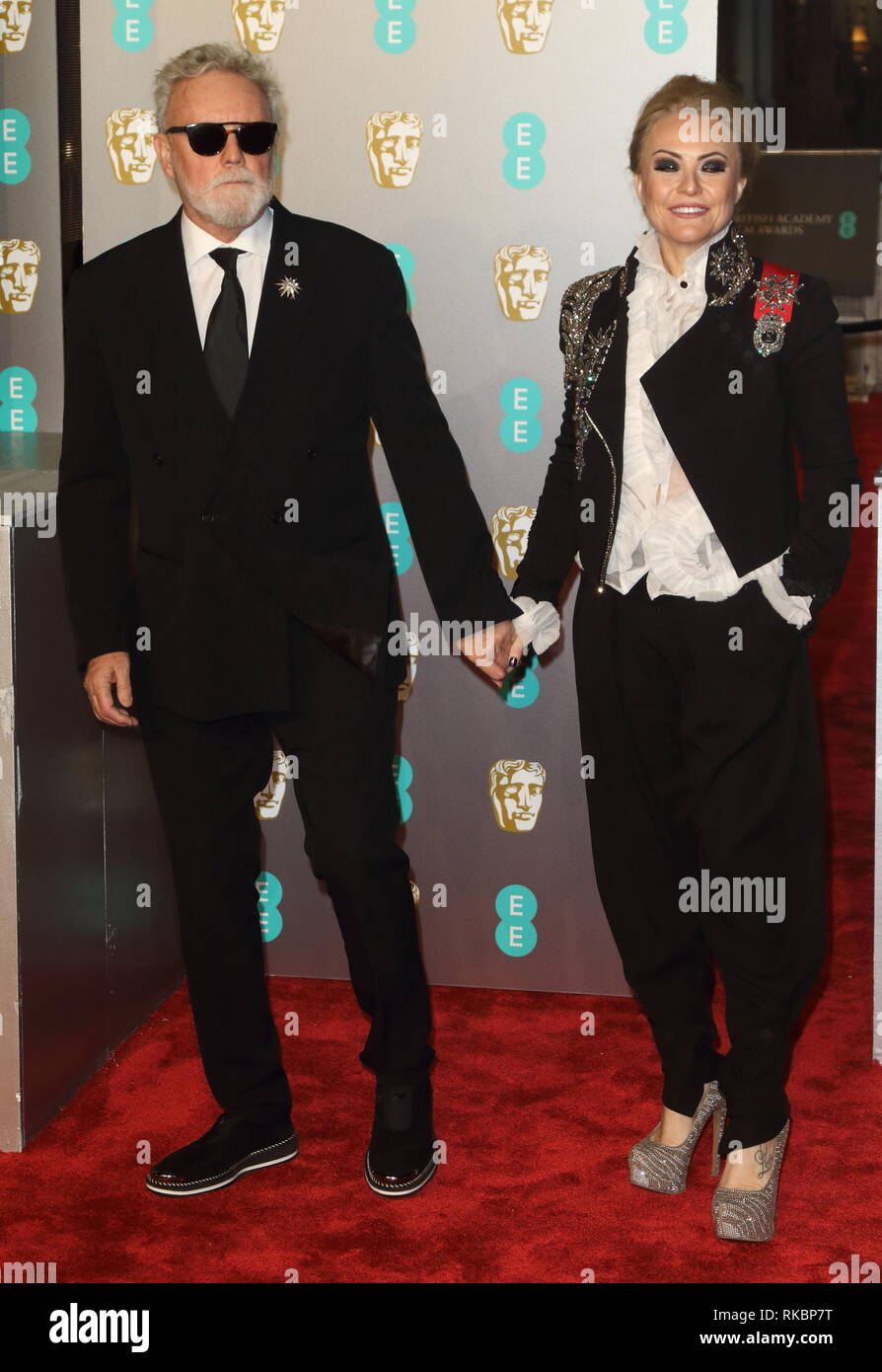 Roger Taylor e Sarina Potgieter presso l'EE British Academy Film Awards presso il Royal Albert Hall, Kensington Foto Stock