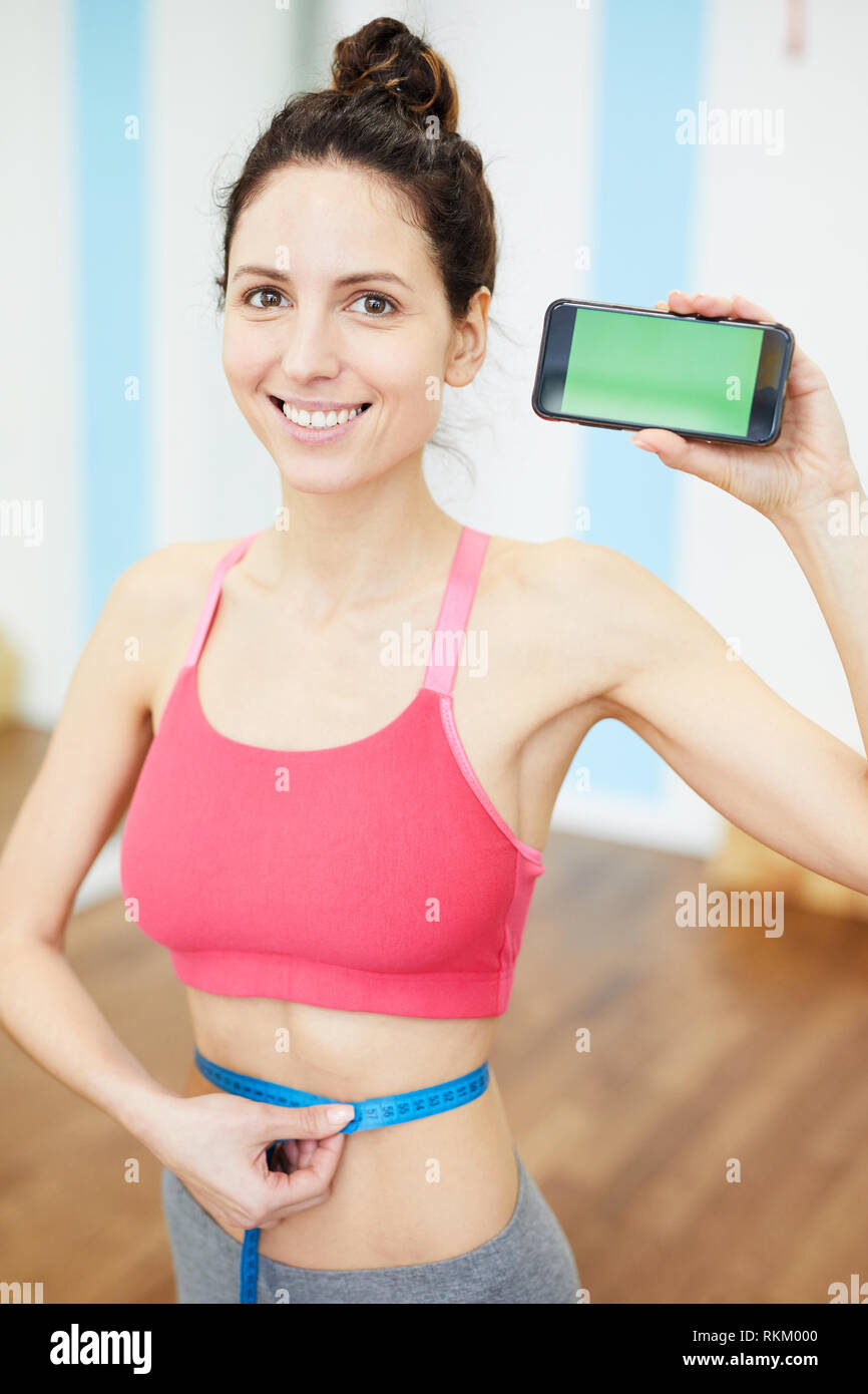 Donna presentando Weightloss App Foto Stock