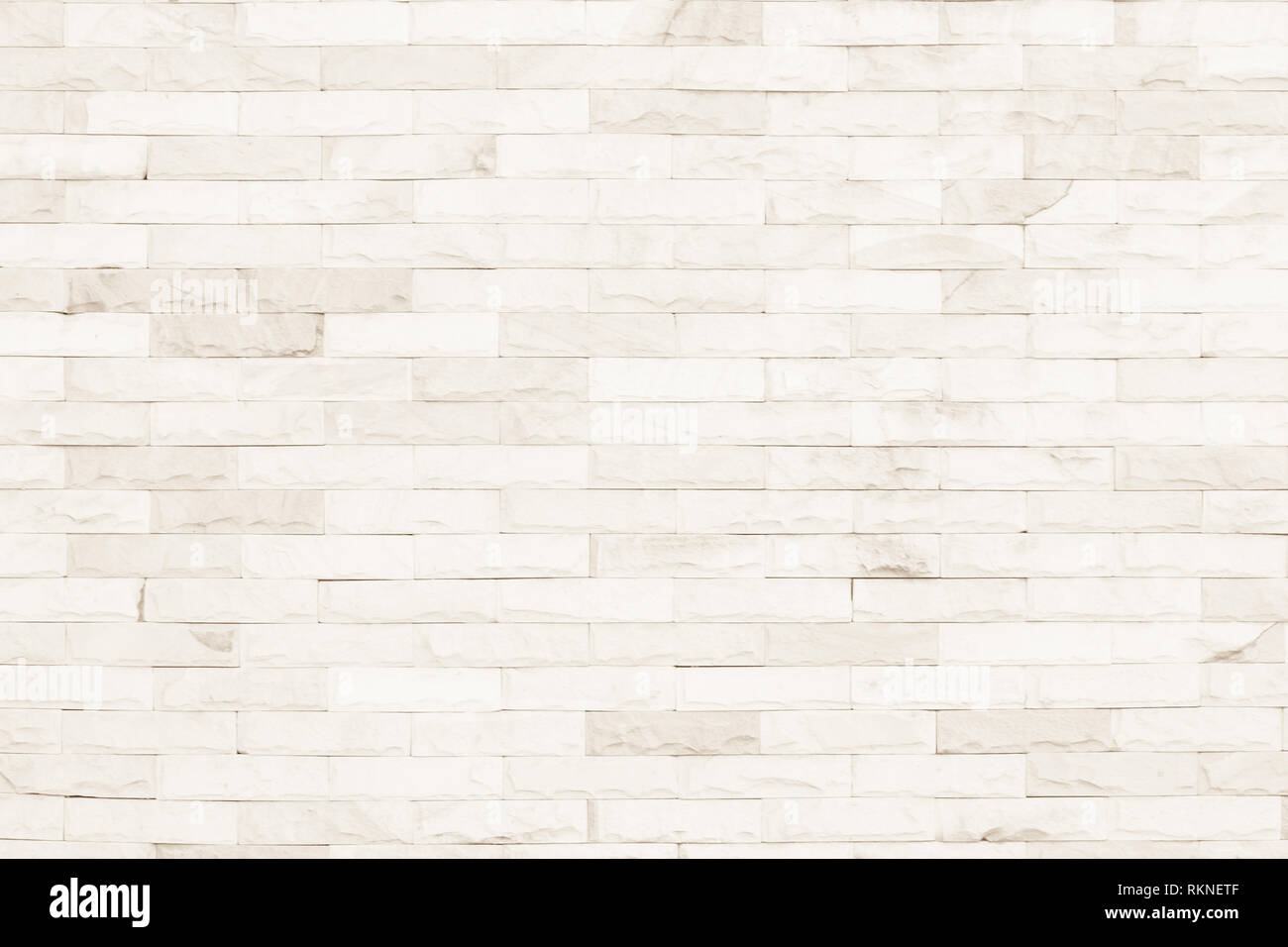 Colori crema e bianco muro di mattoni arte calcestruzzo o pietra texture di sfondo carta da parati in astratto di calcare la vernice per pavimenti e i compiti di scuola/muratura o Foto Stock