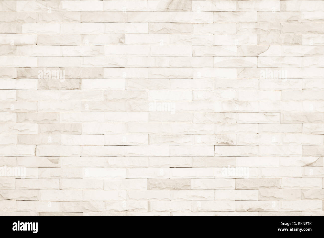 Colori crema e bianco muro di mattoni arte calcestruzzo o pietra texture di sfondo carta da parati in astratto di calcare la vernice per pavimenti e i compiti di scuola/muratura o Foto Stock