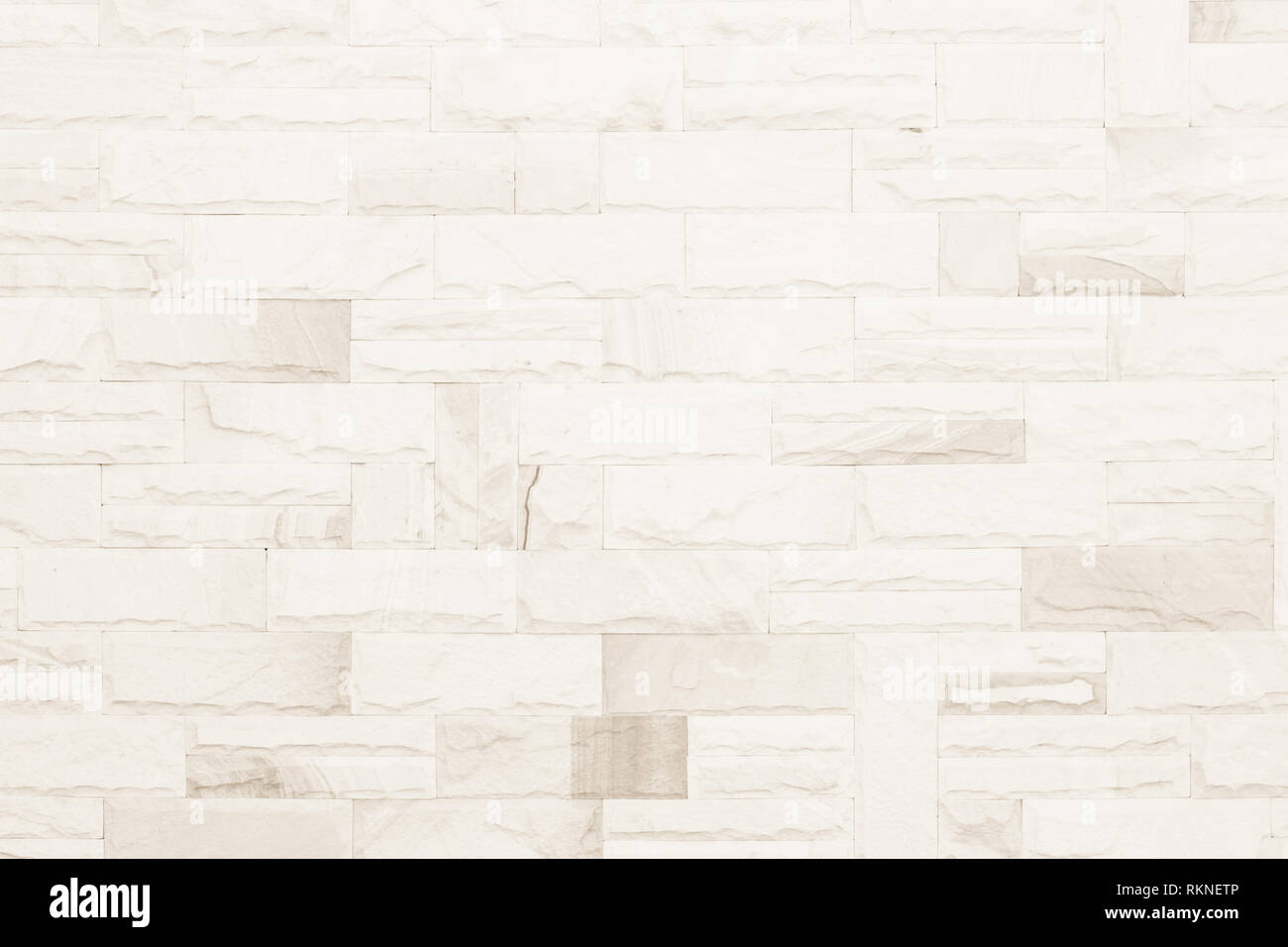 Colori crema e bianco muro di mattoni arte calcestruzzo o pietra texture di sfondo carta da parati in astratto di calcare la vernice per pavimenti e i compiti di scuola/muratura o Foto Stock