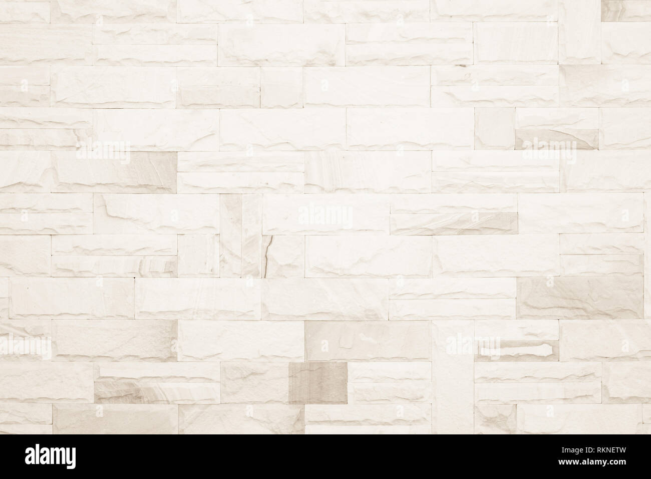 Colori crema e bianco muro di mattoni arte calcestruzzo o pietra texture di sfondo carta da parati in astratto di calcare la vernice per pavimenti e i compiti di scuola/muratura o Foto Stock