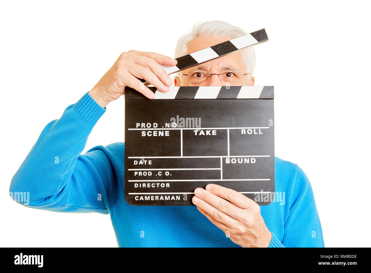 L'uomo come un direttore appare attraverso un lembo di film Foto Stock