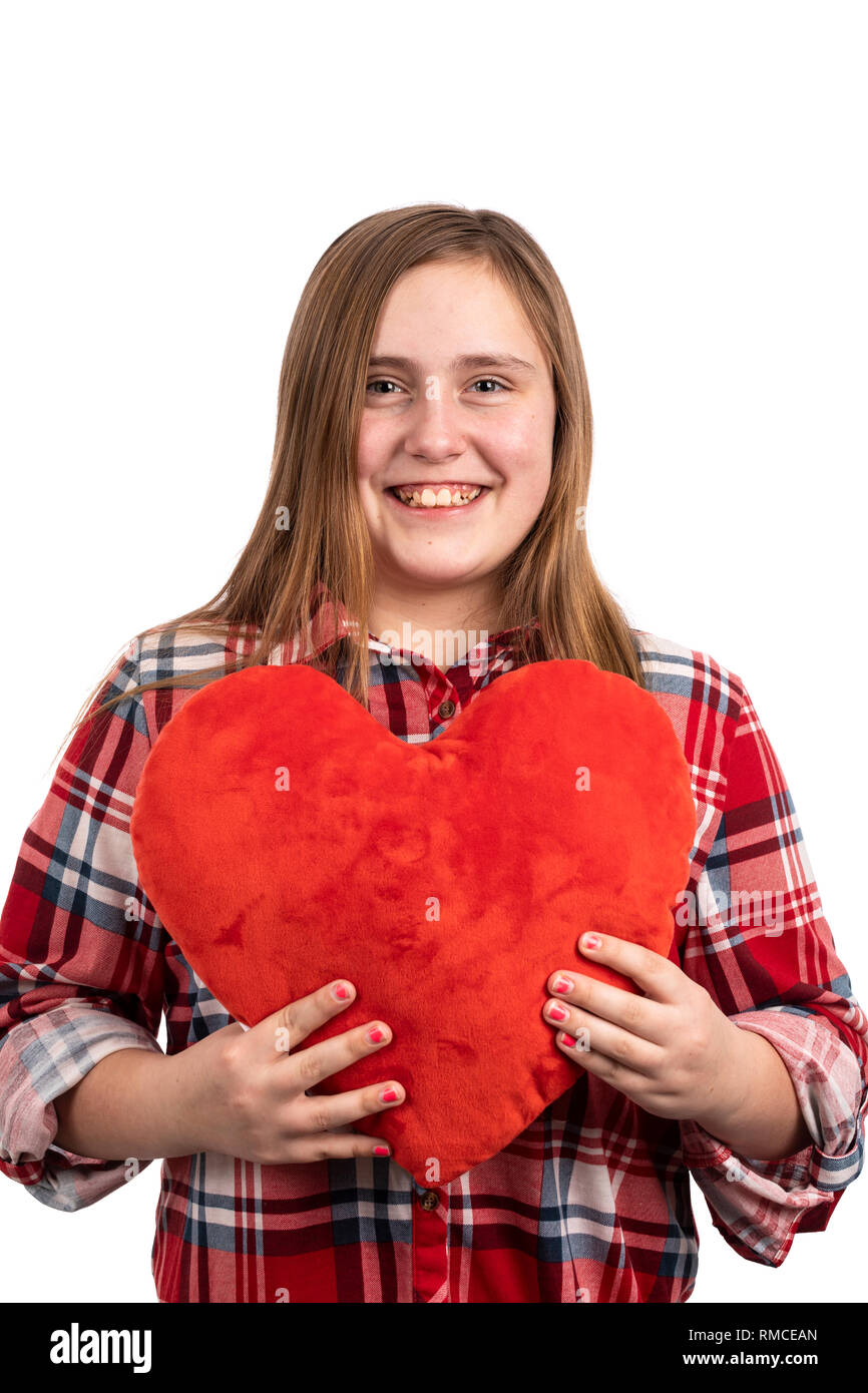 Ragazza con un cuore di peluche Foto Stock