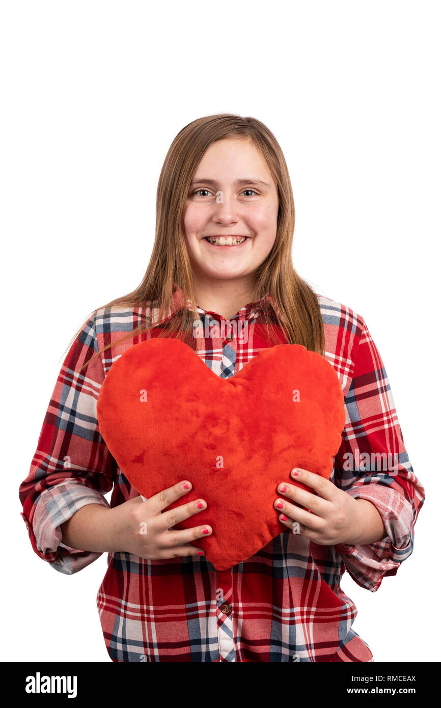 Ragazza con un cuore di peluche Foto Stock