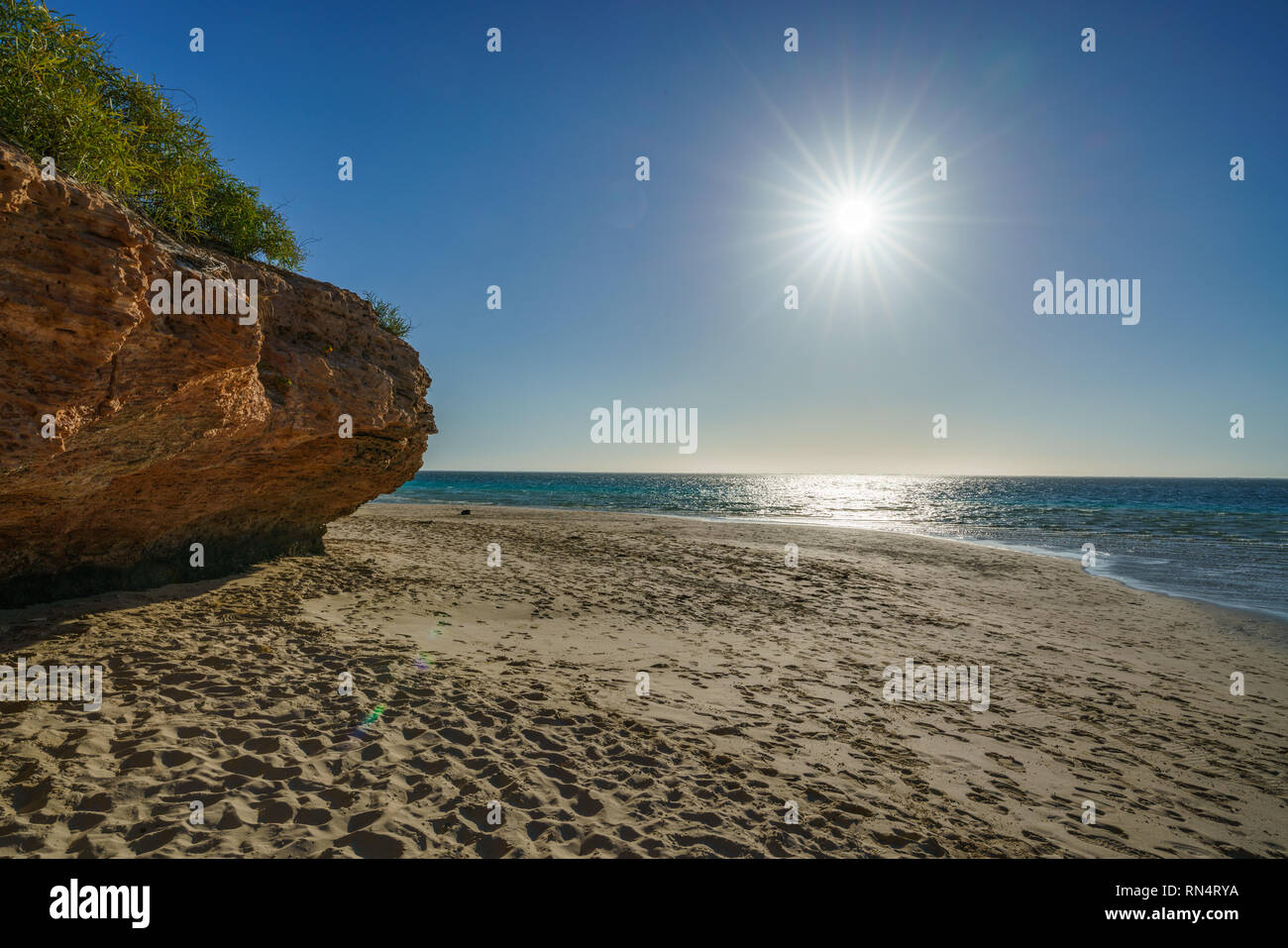 Tramonto sulla spiaggia della baia di bollette, Coral Bay Coral Coast, Australia occidentale Foto Stock