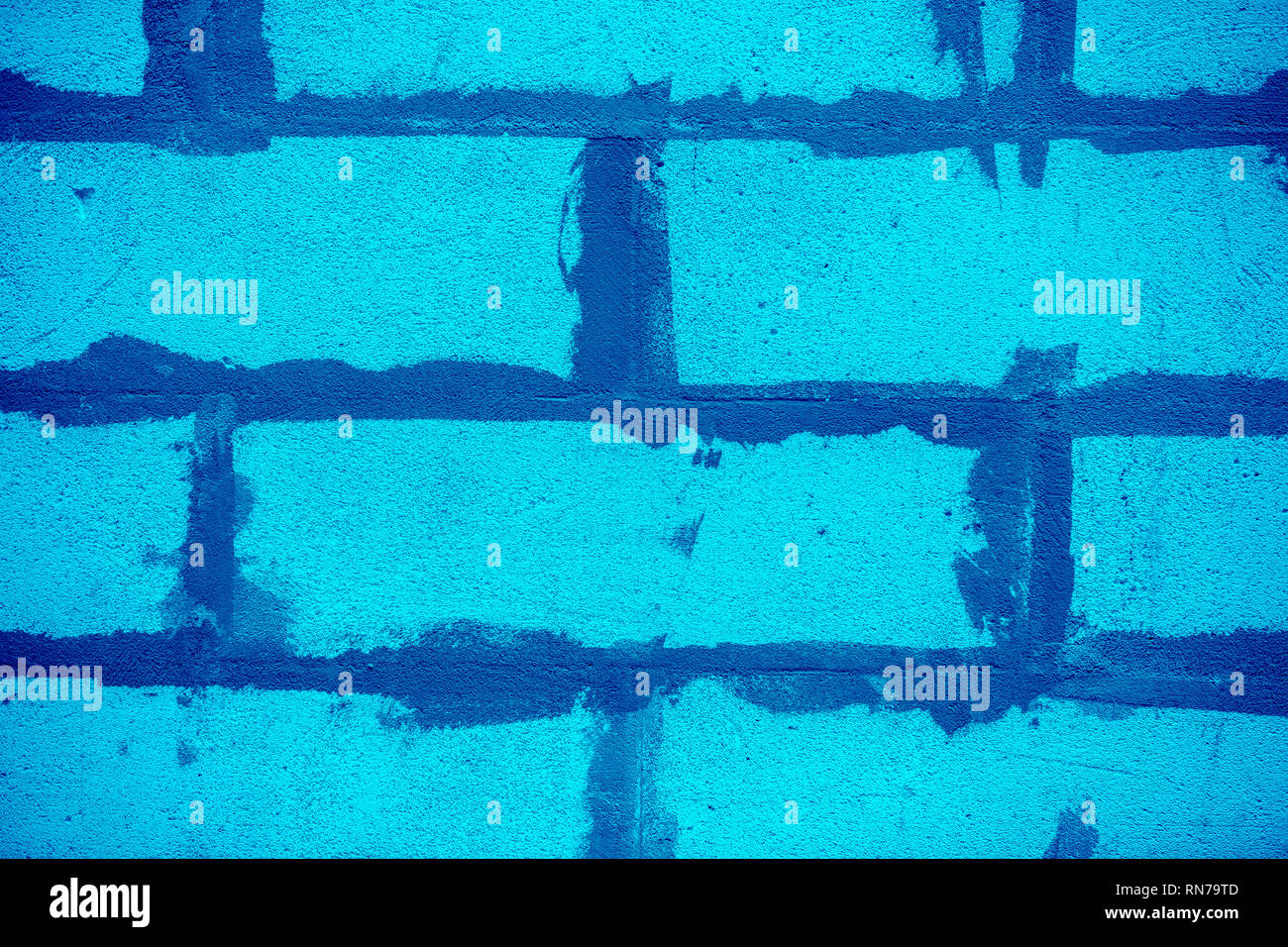 Abstract nei toni del blu e parete di mattoni sfondo Foto Stock