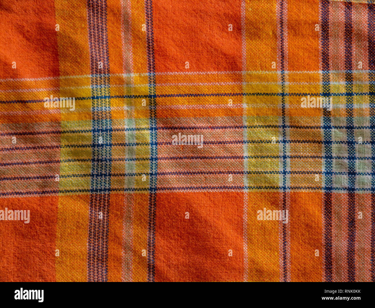 Arancio e giallo plaid stampa come sfondo. Tartan scozzese pattern. Symmetric rombo. Foto Stock