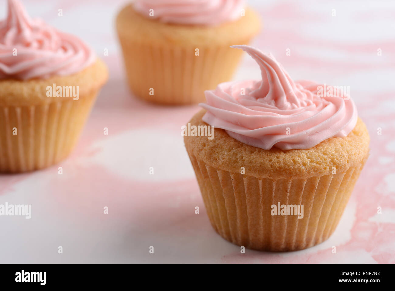 Closeup cupcake rosa con DOF poco profondo Foto Stock