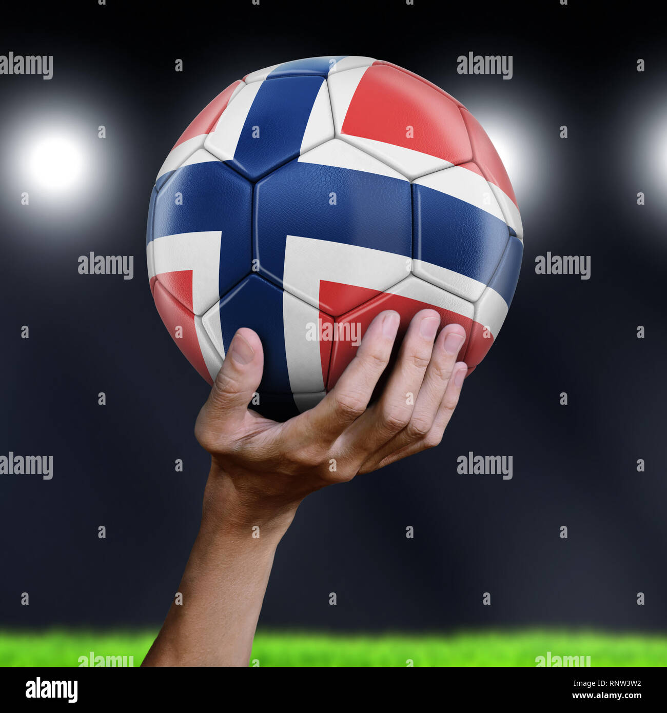 Uomo con pallone da calcio con bandiera Foto Stock