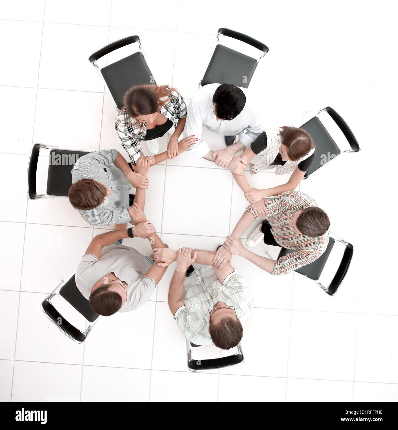 Vista superiore.creative business group piegato fuori delle mani di un cerchio Foto Stock