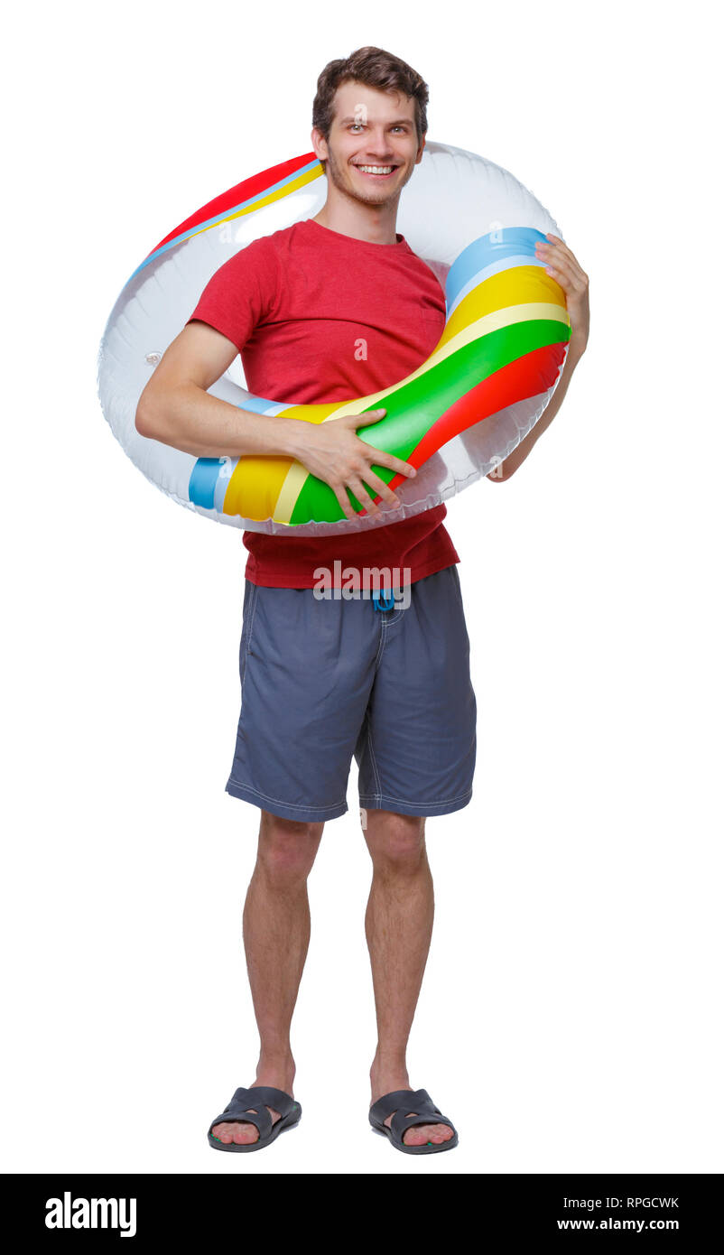 Vista frontale di un uomo in pantaloncini corti con un cerchio gonfiabile. guy sulla spiaggia. Vista posteriore di raccolta persone. vista posteriore di persona. Isolato su bianco Foto Stock