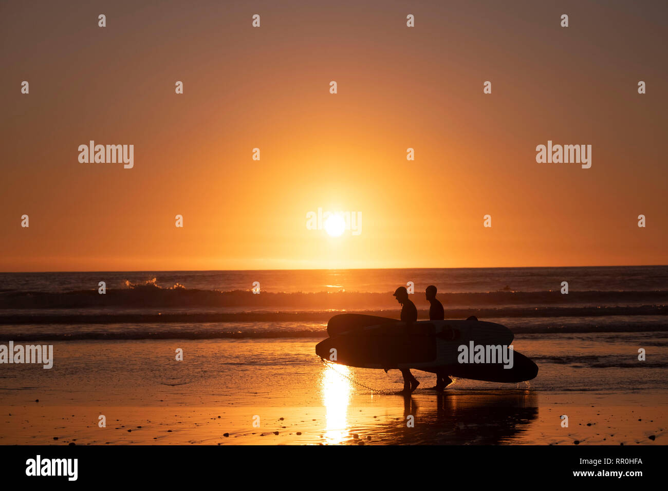 Surf tramonto Foto Stock