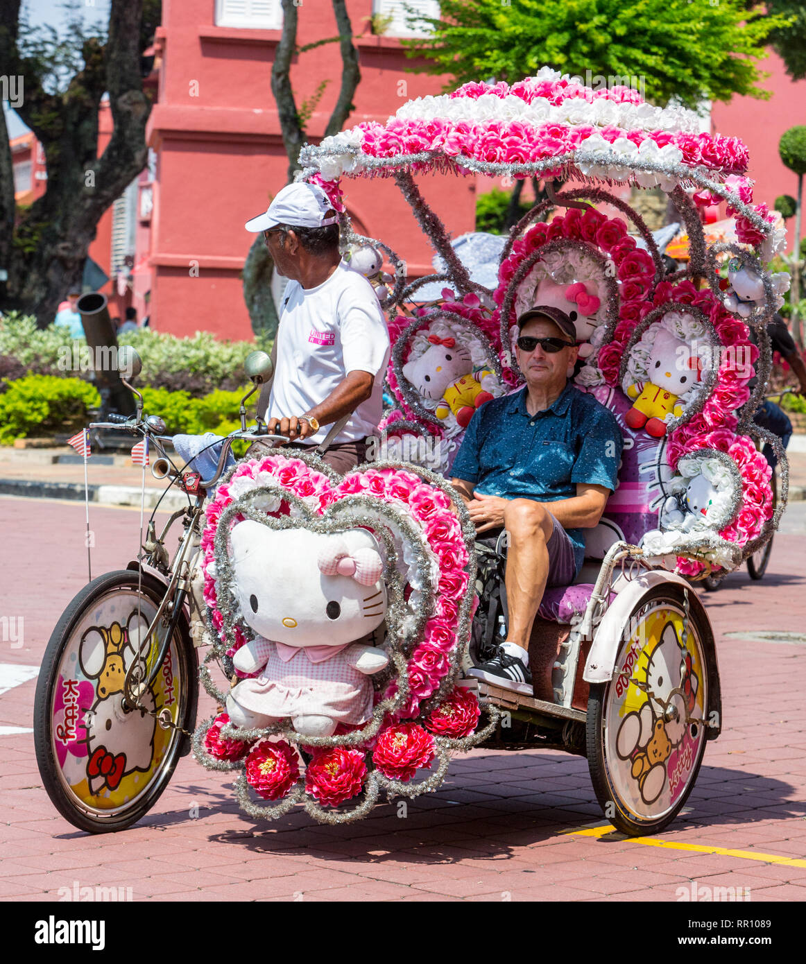 Uomo di equitazione in riscio', Melaka, Malaysia. Foto Stock