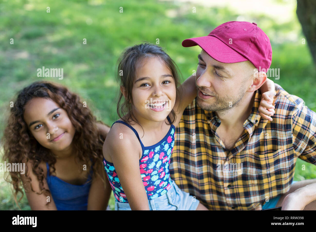 Ritratto di padre Felice e figlie Foto Stock
