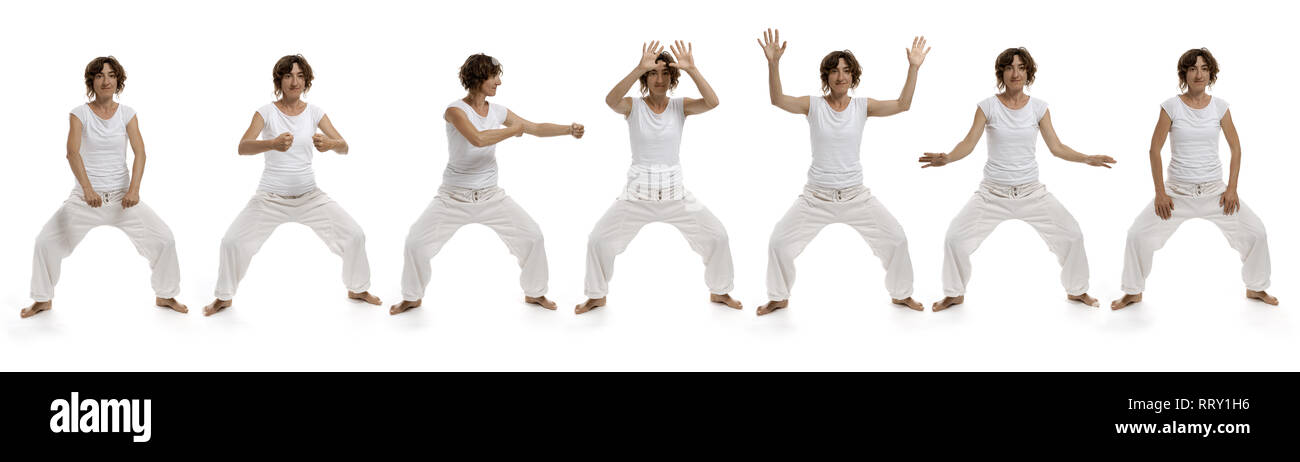 Ba duan jin il settimo esercizio sette degli otto pezzi di brocade Chigong Quigong, Immagine 7/8 "stringono i pugni e abbagliamento' Foto Stock