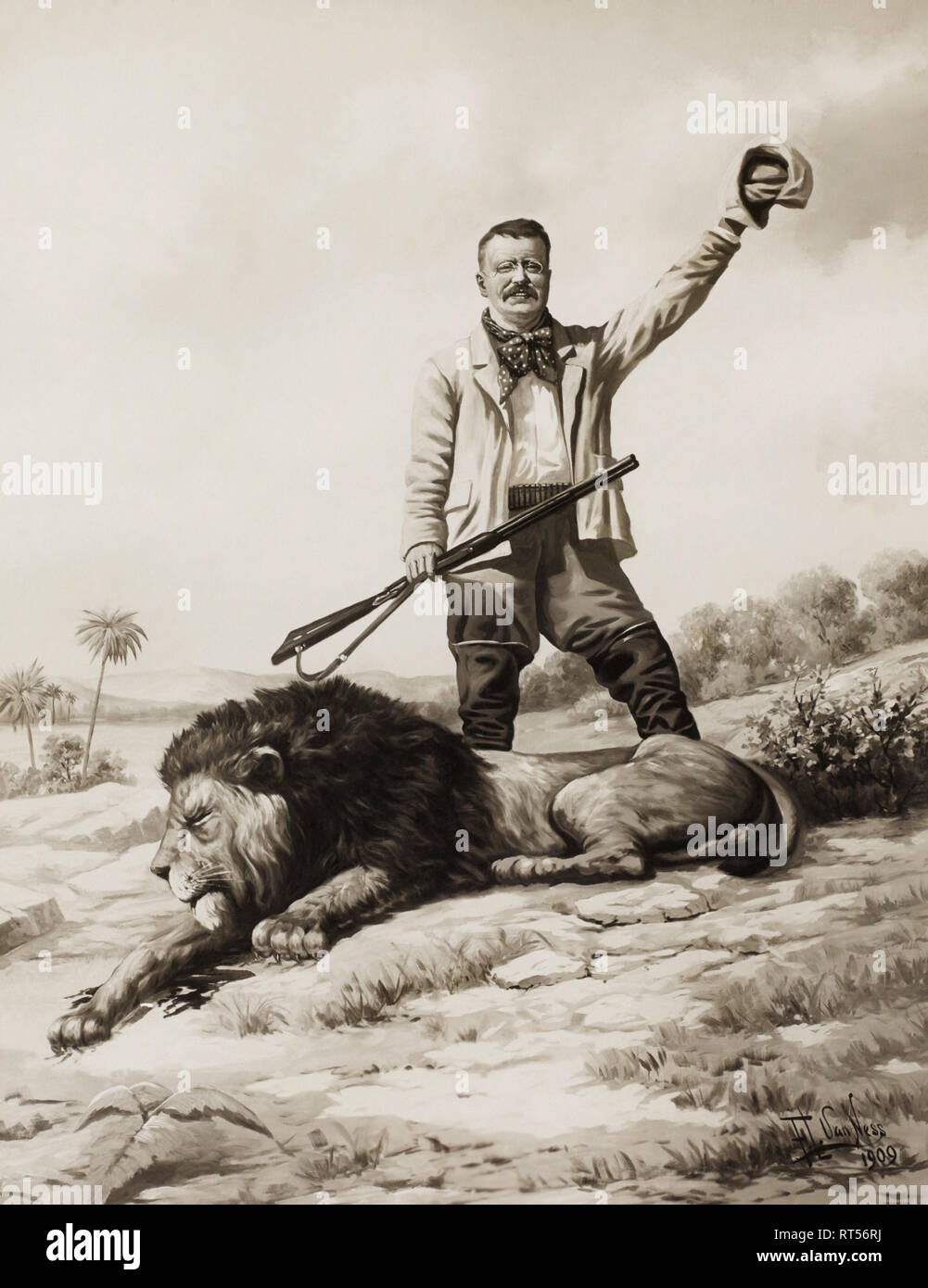 Teddy Roosevelt agitando il suo cappello in trionfo dopo uccisione di un leone durante una battuta di caccia. Foto Stock