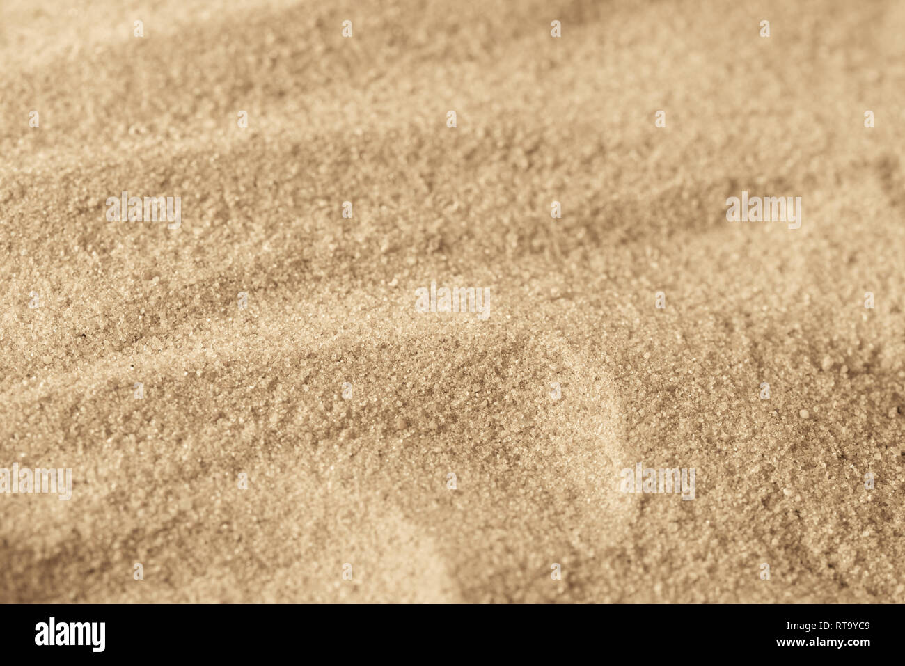 Sabbia texture di sfondo il fuoco selettivo Foto Stock
