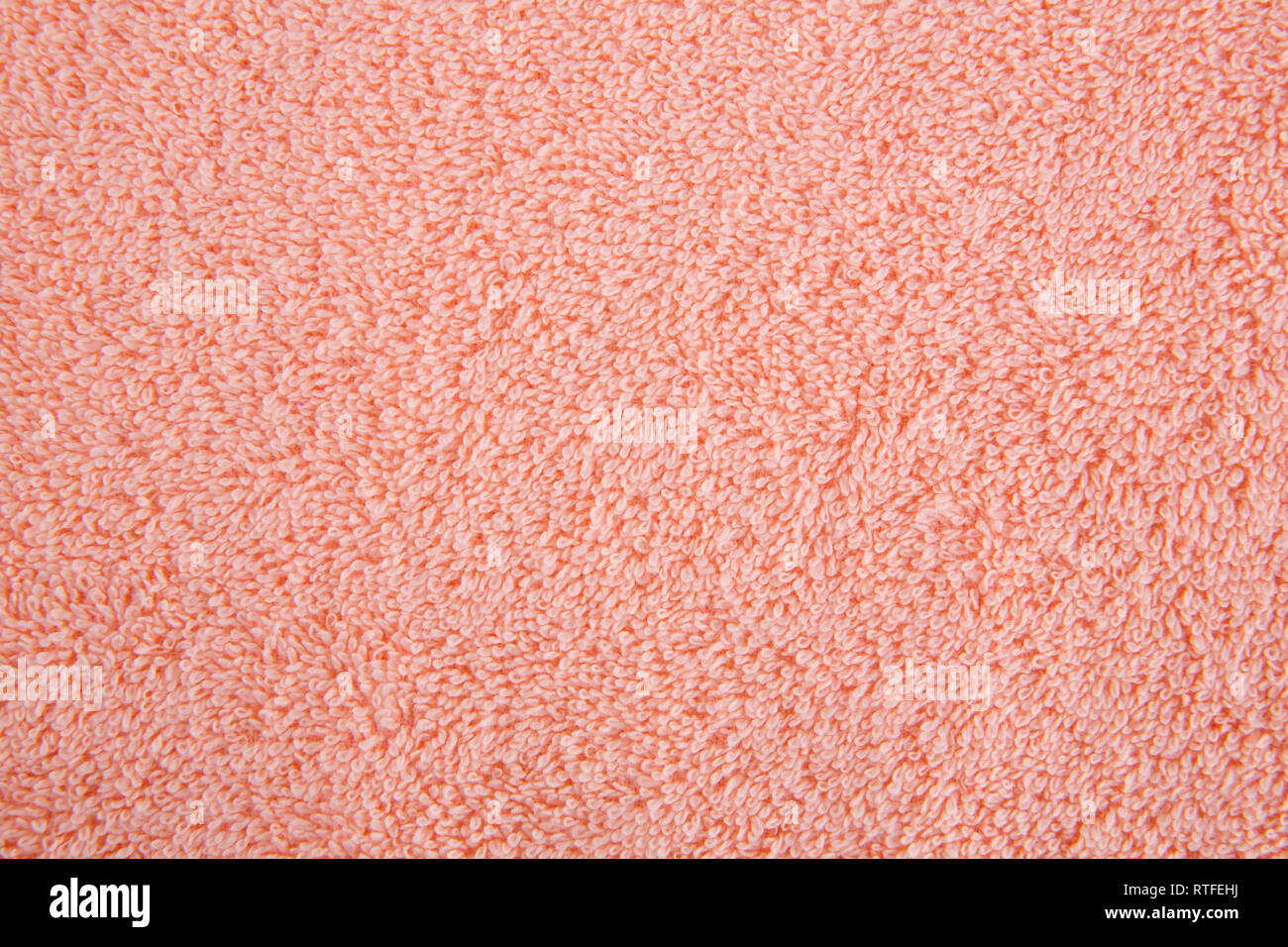 Peach colore texture asciugamano come sfondo, primo piano immagine. Foto Stock