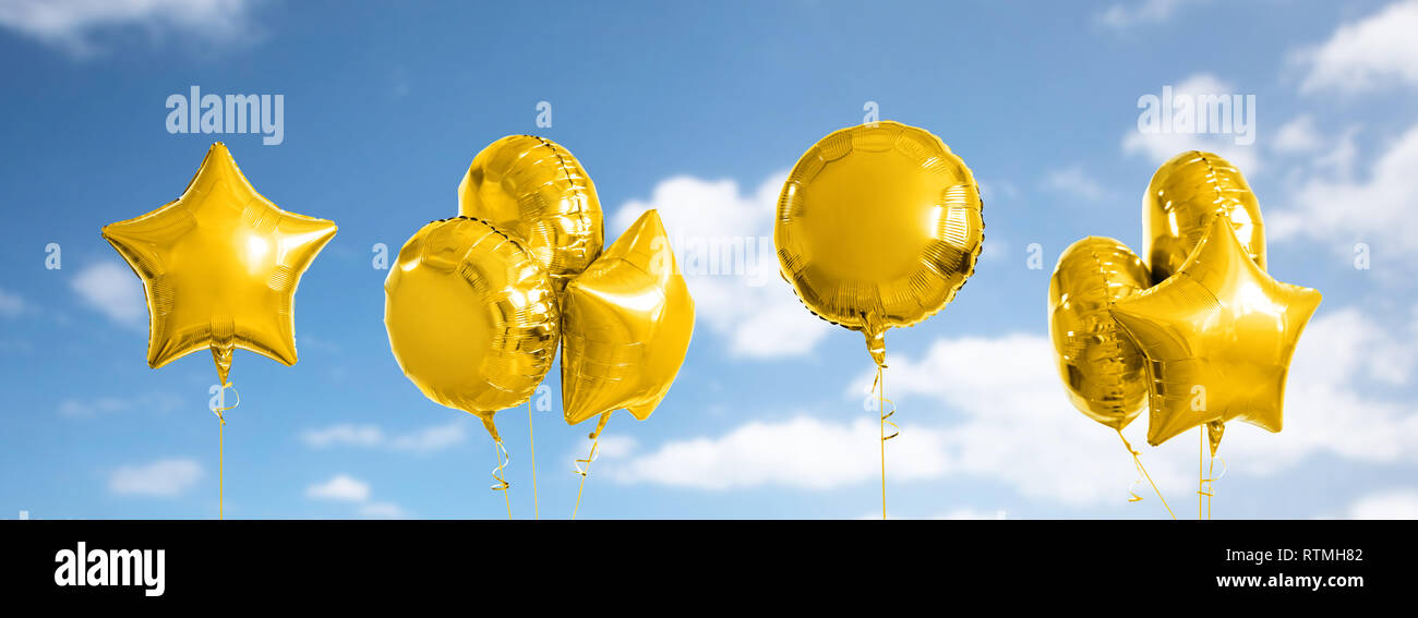 Molti metallizzato oro palloni di elio su bianco Foto Stock