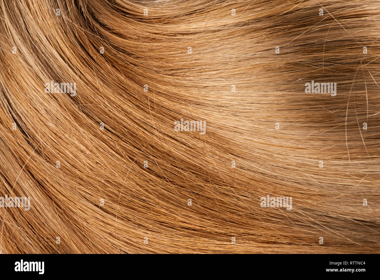 Bionda ondulata capelli umani sullo sfondo Foto Stock