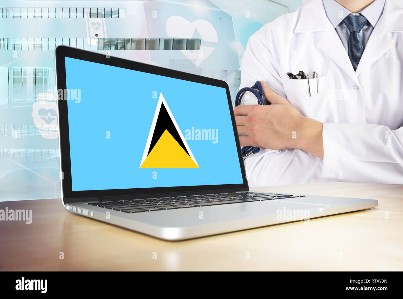 Saint Pierre e Miquelon sistema sanitario in tema tech. Bandiera sullo schermo del computer. Dottore in piedi con uno stetoscopio in ospedale. Cryptocurrency e B Foto Stock