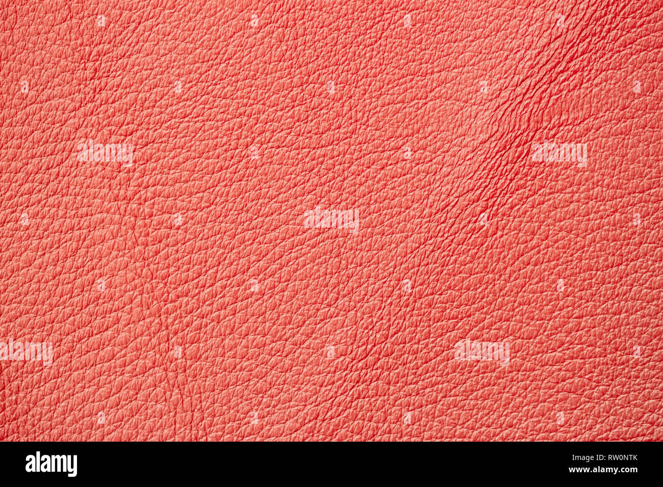 Coral colore arancio della texture in pelle, sfondo, superficie Foto Stock