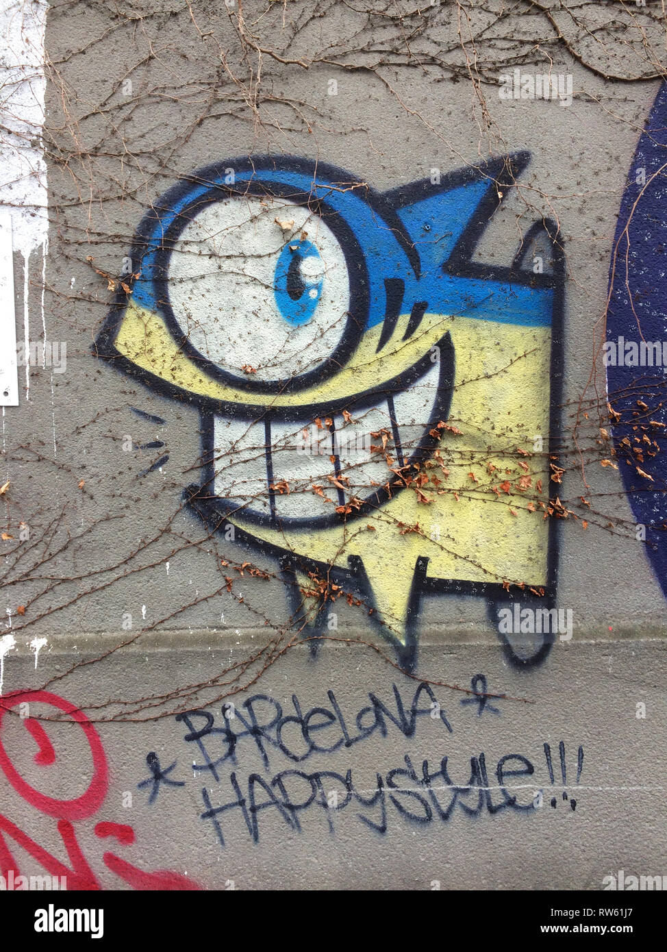Street graffiti Barcellona stile felice (El Pez) originariamente creato dall'artista spagnolo Jose saziare (1999) di Vienna in Austria. Foto Stock