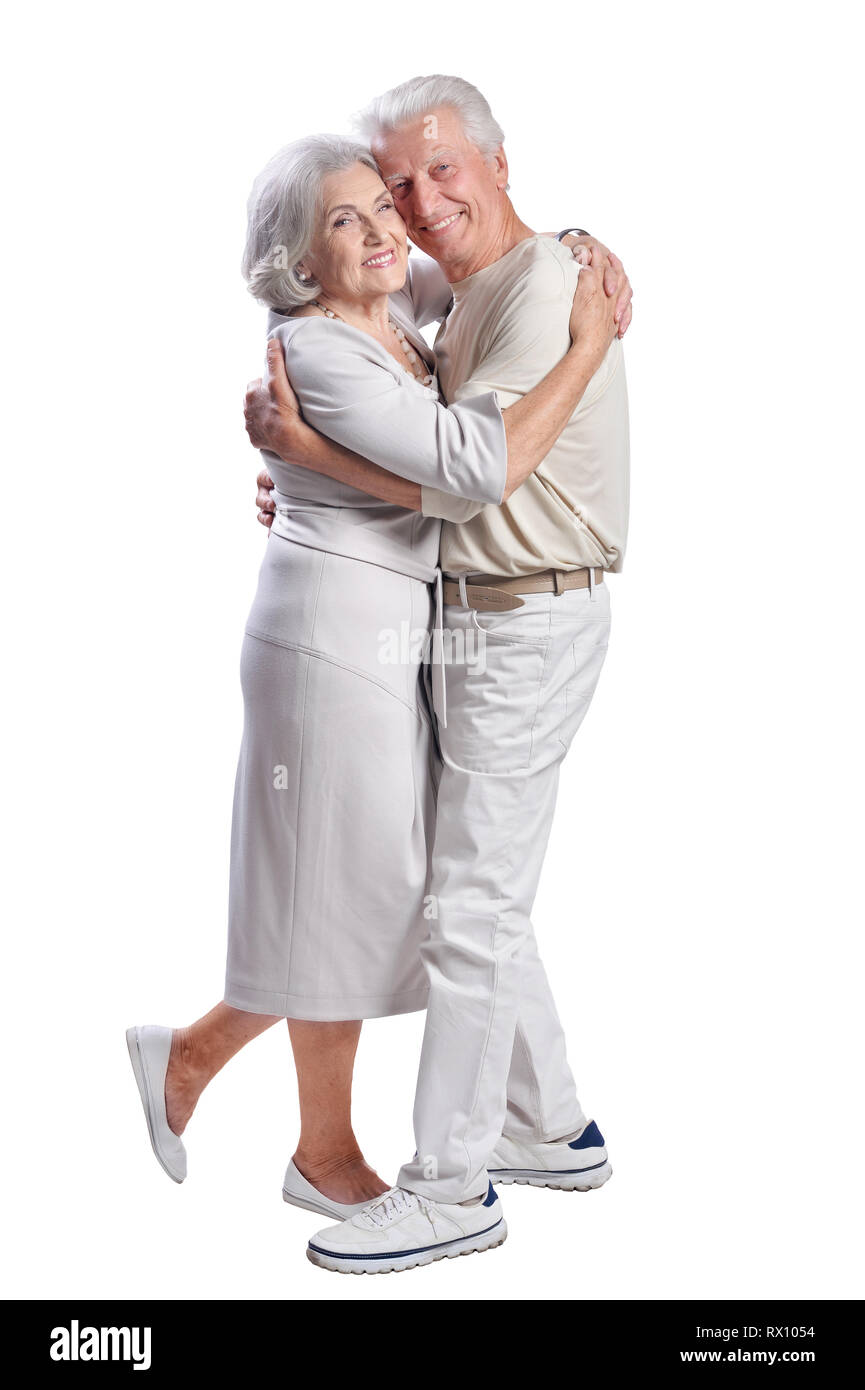 Ritratto di felice coppia senior in posa su sfondo bianco Foto Stock