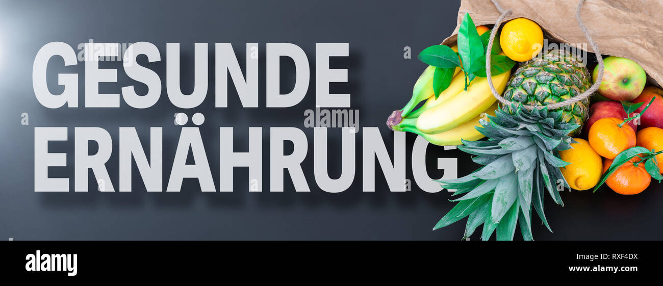 Parole GESUNDE ERNÄHRUNG, tedesco per il mangiare sano o nutrizione sana, con frutta fresca in sacchetto di carta Foto Stock