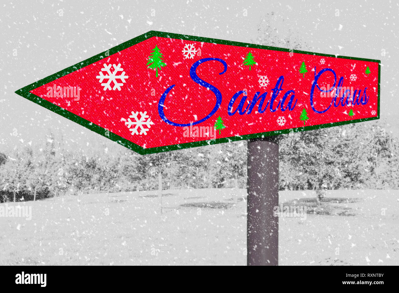 Natale.Santa Claus firmare con un sfondo innevato scena. Foto Stock