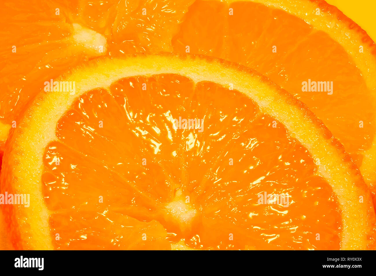 Fresche fettine di arancia dettaglio sullo sfondo Foto Stock