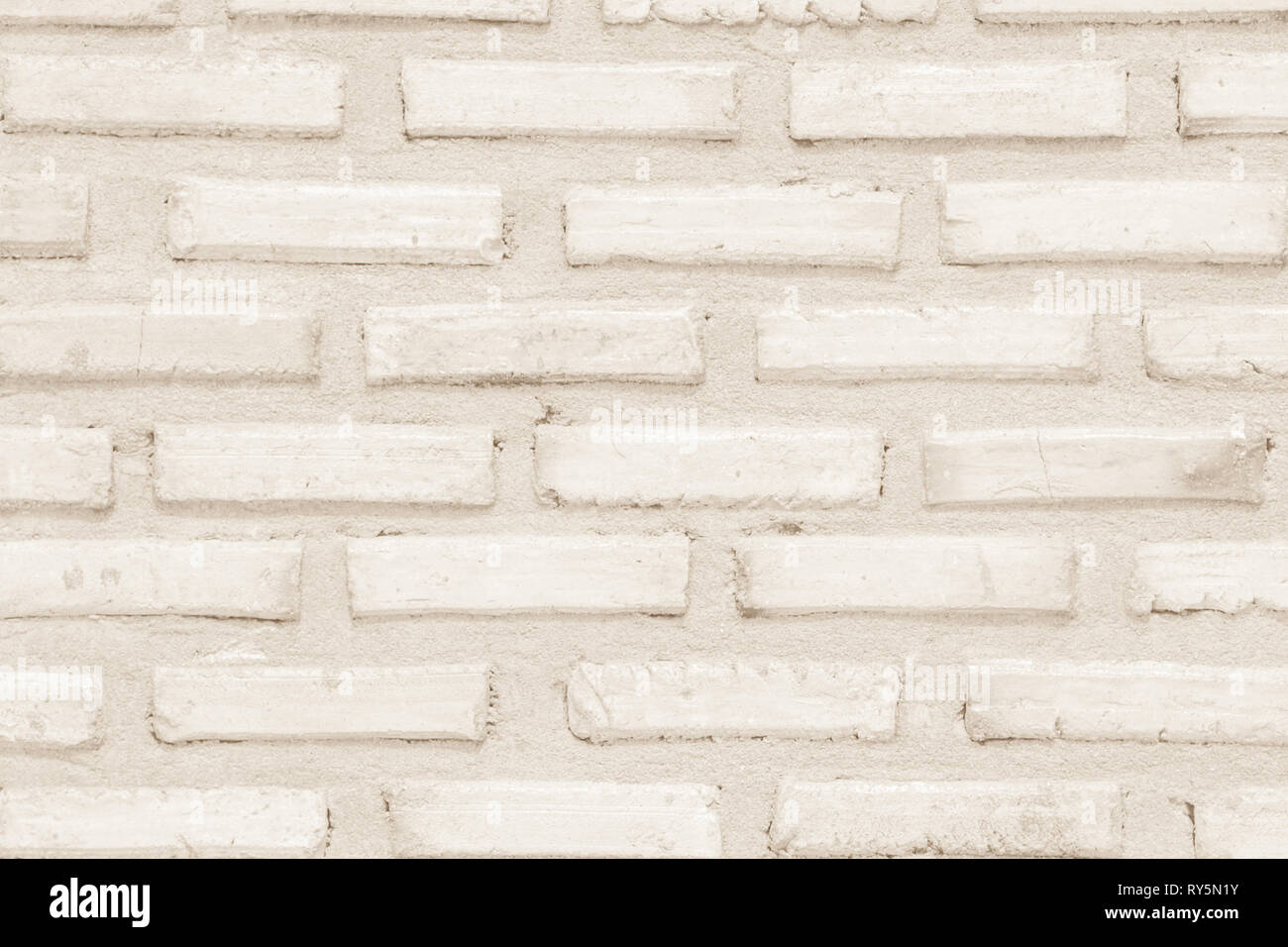 Colori crema e bianco muro di mattoni arte calcestruzzo o pietra texture di sfondo carta da parati in astratto di calcare la vernice per pavimenti e i compiti di scuola/muratura o Foto Stock