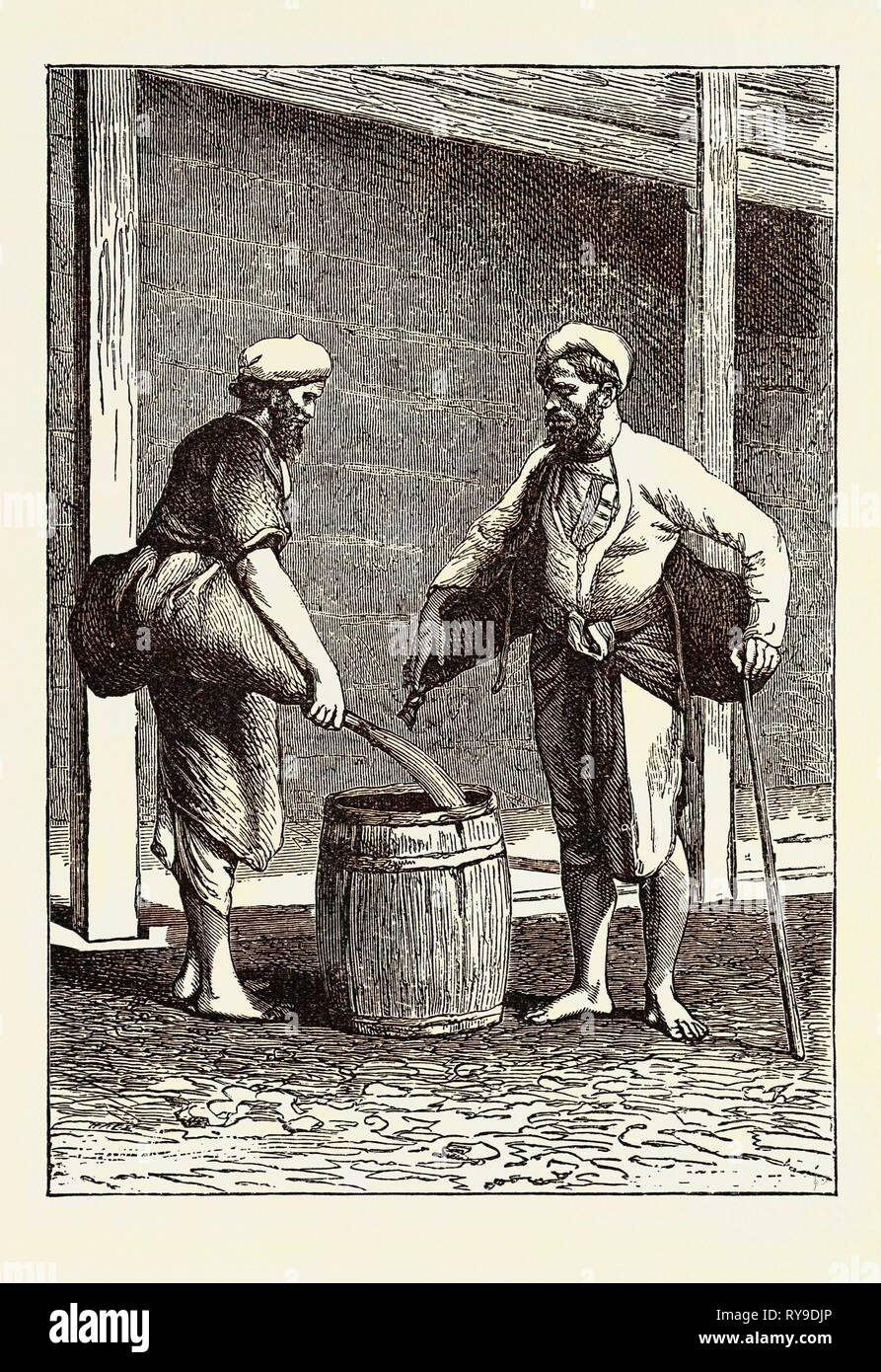 Portatori di acqua di Calcutta, in India. Kolkata o Calcutta è la capitale dello stato indiano del Bengala Occidentale Foto Stock