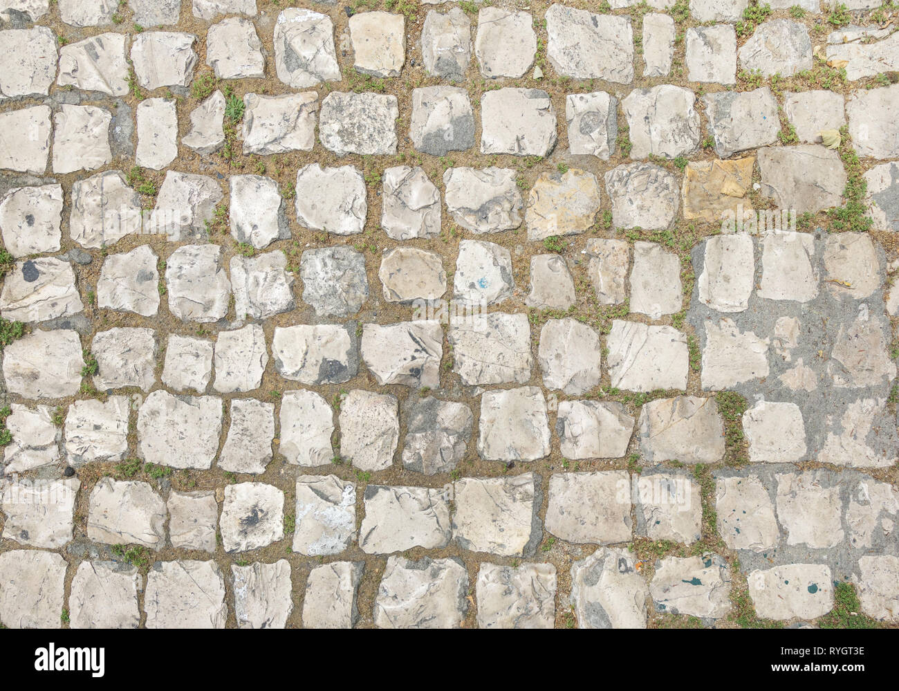 Sfondo astratto di vecchi cobblestone pavement close-up. Foto Stock