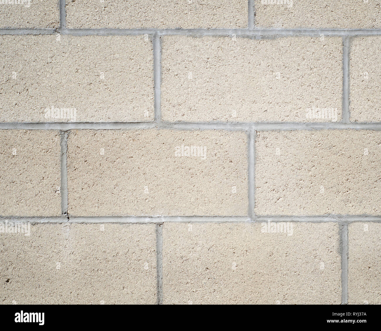 Close-up di un semplice muro di calcestruzzo di recupero. Foto Stock