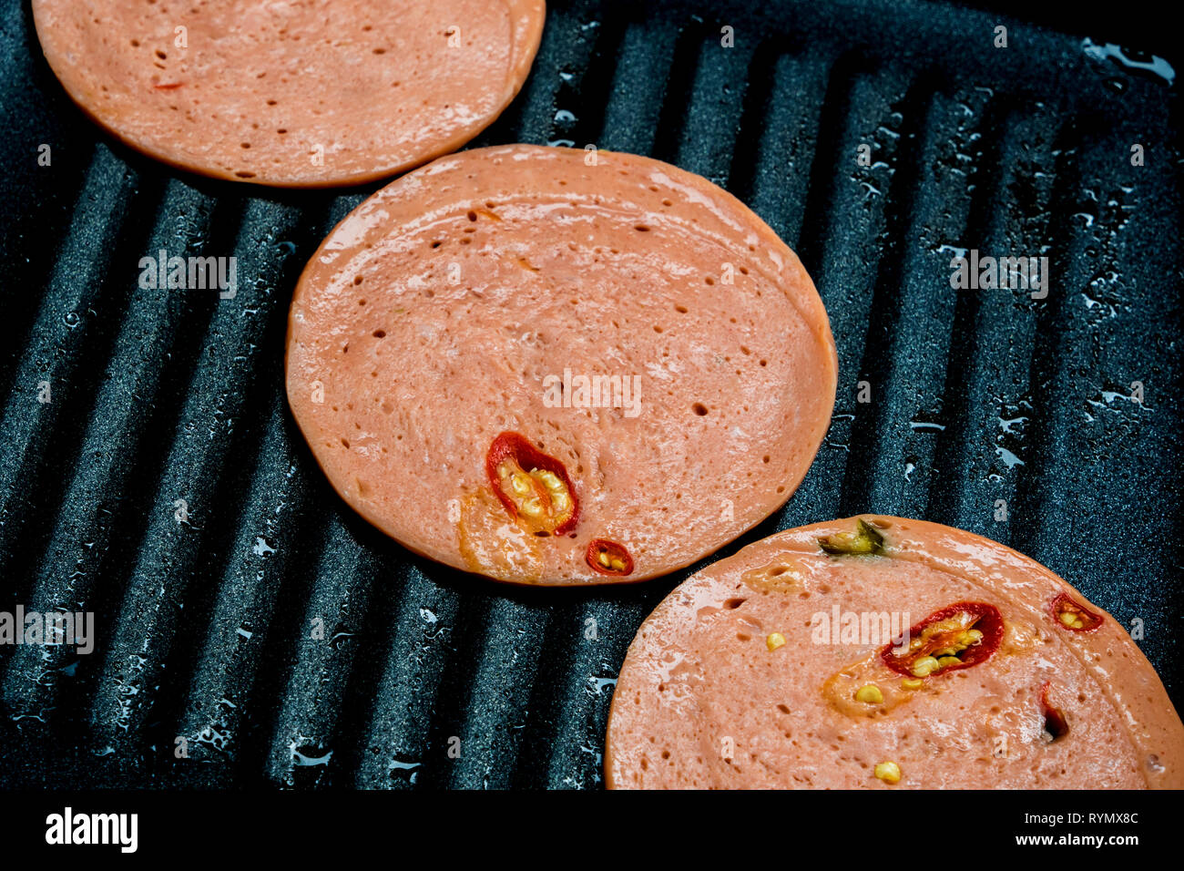 Spezie Bologna fritti in padella di cottura Foto Stock