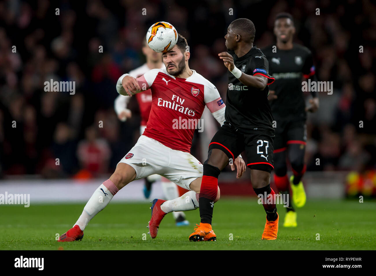 Londra, Regno Unito. Xiv Mar, 2019. Sead Kolašinac di Arsenal e Hamary Traoré di Rennes durante la UEFA Europa League Round di 32 seconda gamba match tra Arsenal e Rennes presso l'Emirates Stadium di Londra, Inghilterra il 14 marzo 2019. Foto di Salvio Calabrese. Solo uso editoriale, è richiesta una licenza per uso commerciale. Nessun uso in scommesse, giochi o un singolo giocatore/club/league pubblicazioni. Credit: UK Sports Pics Ltd/Alamy Live News Foto Stock