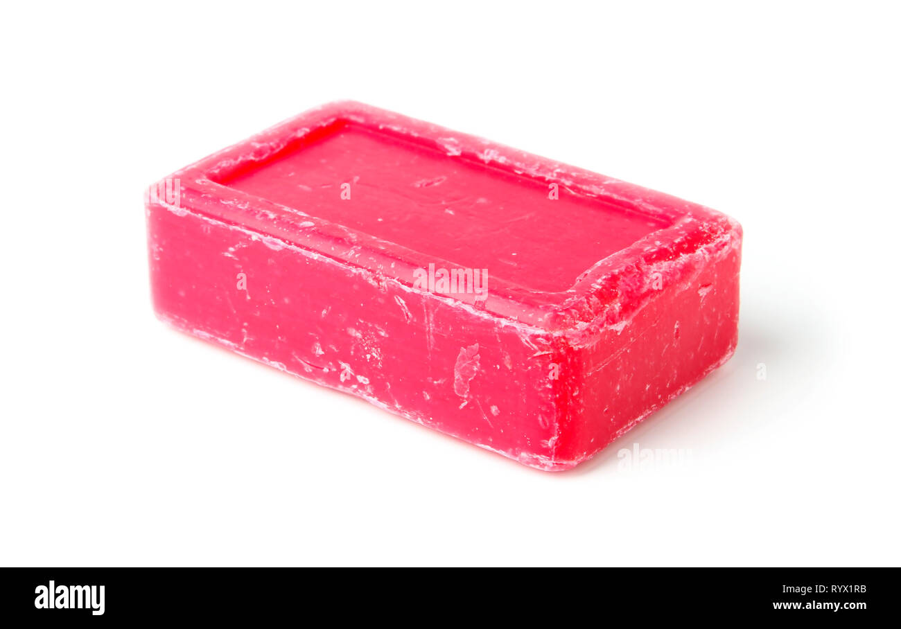 Un pezzo di sapone rosa vicino isolata su bianco Foto Stock