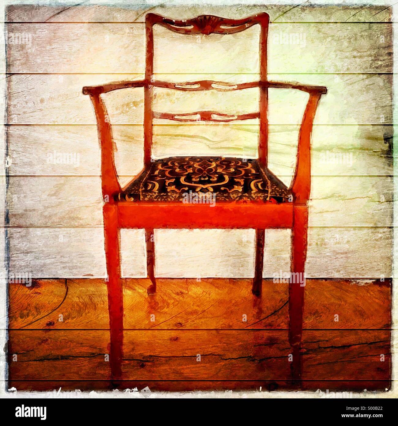 Sedia antica su uno sfondo di legno Foto Stock