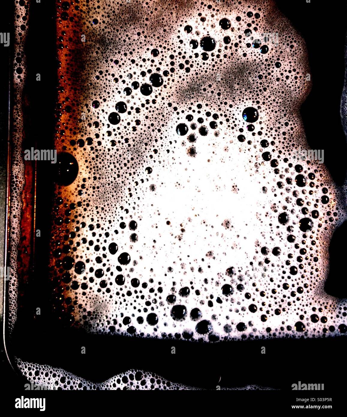 La tostatura stagno con acqua saponata Foto Stock