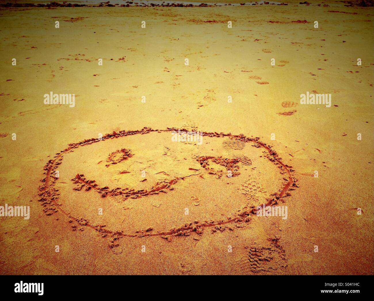 Smiley face in sabbia Foto Stock