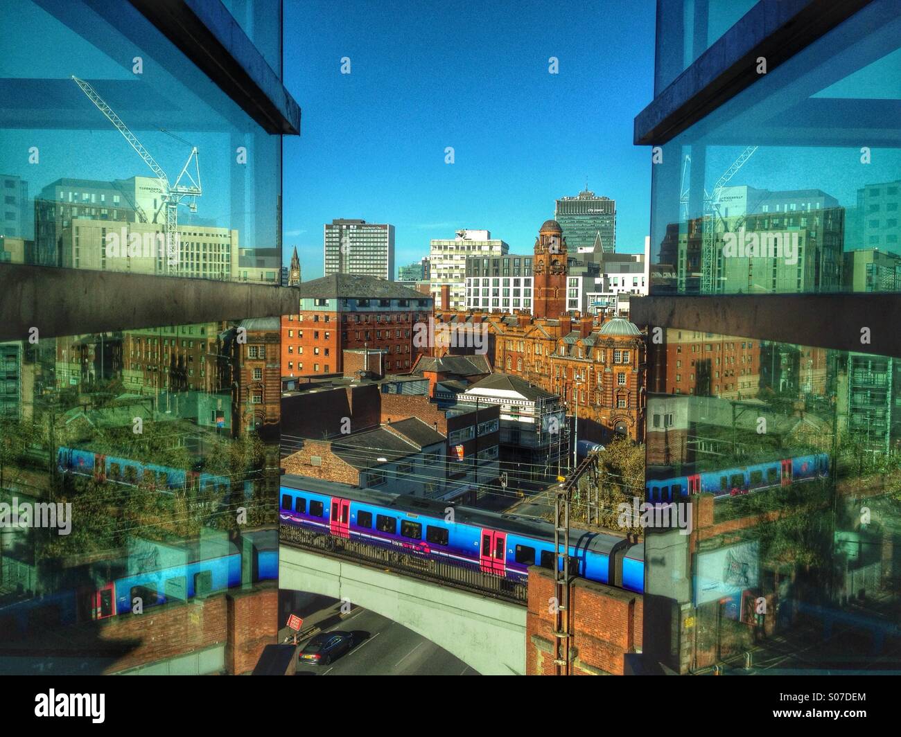 Lo skyline di Manchester e riflessioni Foto Stock