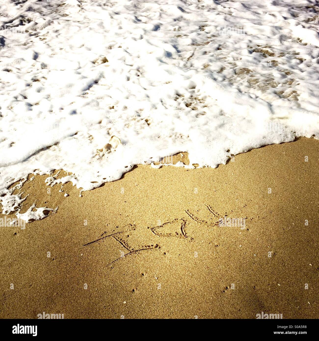 I love u scritto nella sabbia al litorale. Manhattan Beach, California USA. Foto Stock
