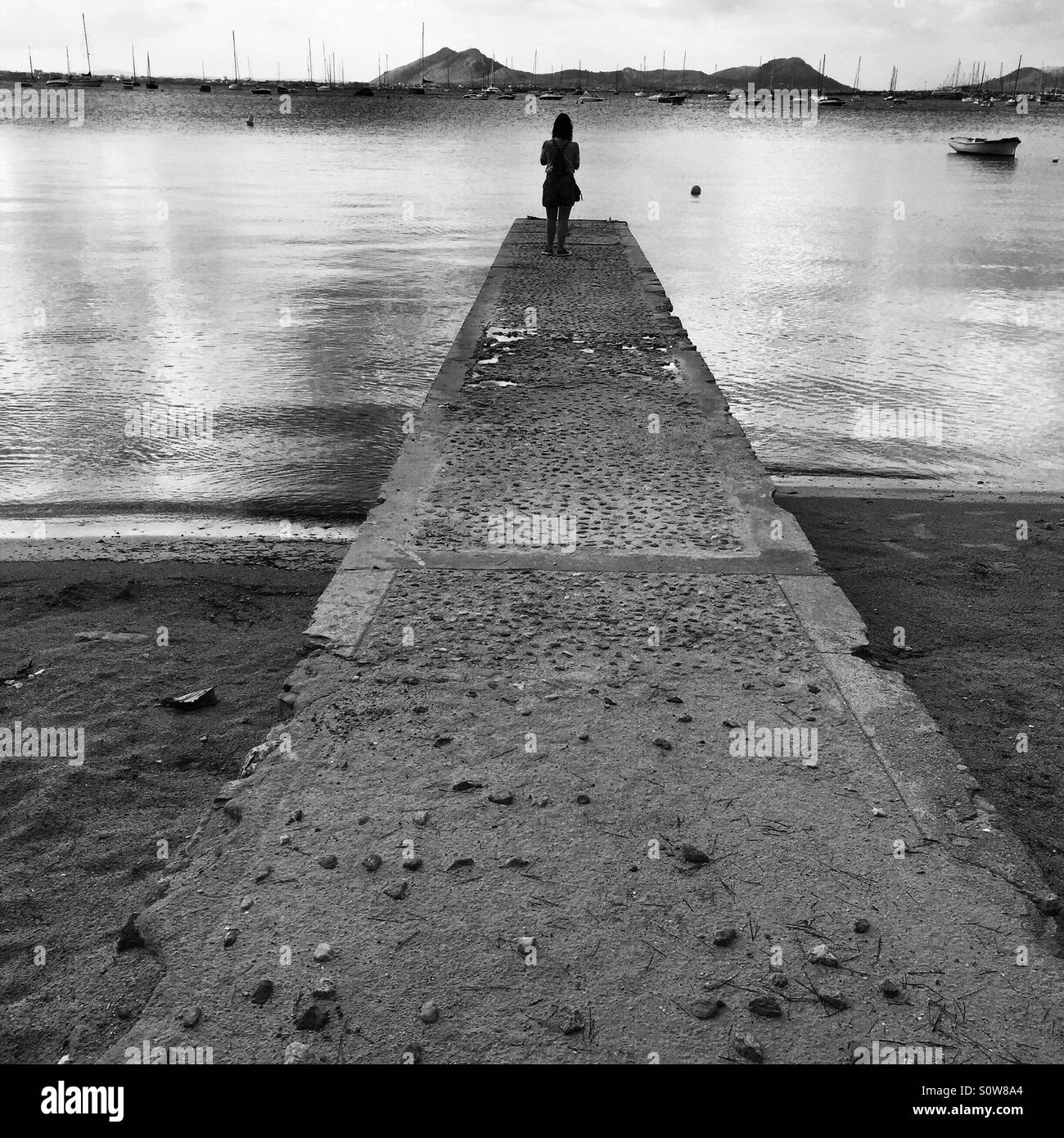 Lonesome su un molo Foto Stock